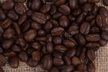 Roasted brown coffee beans, can be used as a background and texture