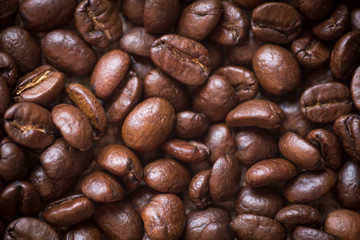 Roasted brown coffee beans, can be used as a background and texture