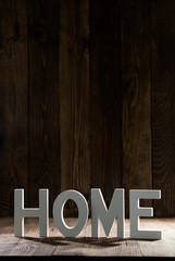 sign Home on rustic wood