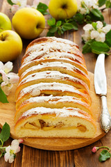 Apple pie dough with raisins in a roll.
