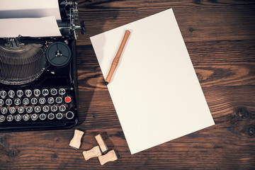 Retro typewriter on wooden planks