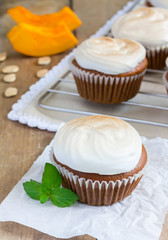 Homemade pumpkin cupcakes decorated with meringue