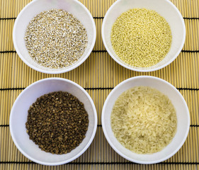 Cereals in plates, spices on napkin isolated