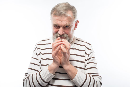 an old man with a beard praying to God