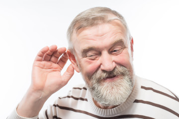 an old man with a beard is hard of hearing, health problems