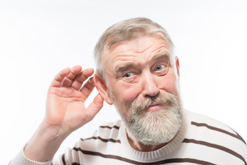 an old man with a beard is hard of hearing, health problems