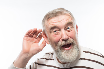 an old man with a beard is hard of hearing, health problems