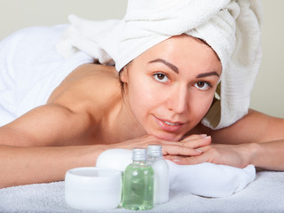 Obraz na płótnie Canvas Closeup portrait of attractive woman enjoying day spa in luxury beauty salon
