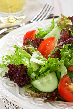 Salad / Fresh salad with green, red lettuce, tomato and cucumber