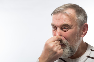 Fototapeta premium holding his nose bad smell