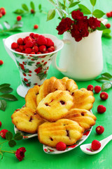 Madeleine cookies with wild strawberries. .