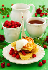 Homemade waffles with wild strawberries. .