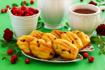 Madeleine cookies with wild strawberries. .