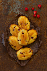 Madeleine cookies with wild strawberries. .