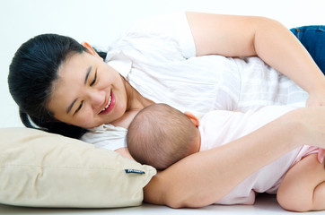 Asian woman breastfeeding her baby