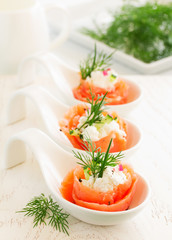 Appetizer of salted salmon and ricotta.