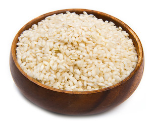 Rice in a wood bowl on a white background