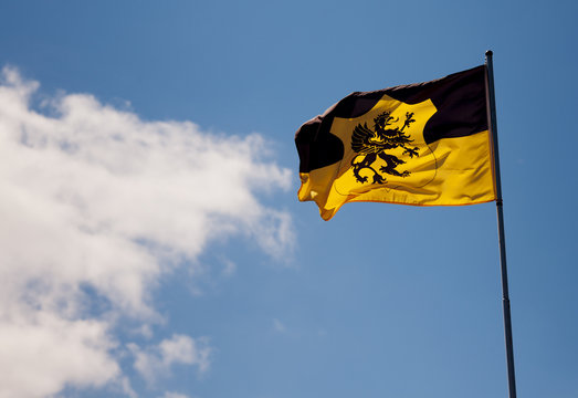 black lion flag with cloud behind