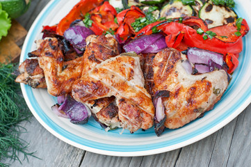 Grilled chicken wings with vegetables