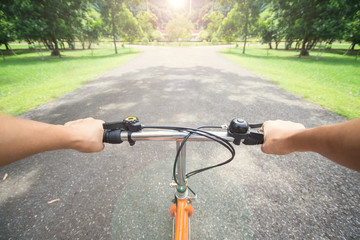 Fototapeta na wymiar woman riding a bicycle in park