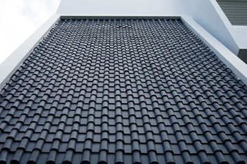 Blue roof tile on white building