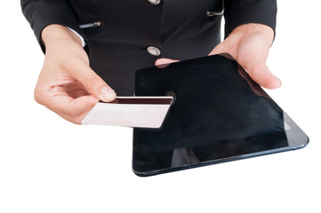Woman hands holding wireless table and debit or credit card
