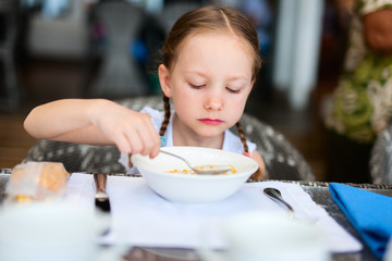 Little girl eating breakfast