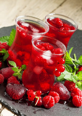 Frozen red tea with raspberries and ice in the authentic Islamic