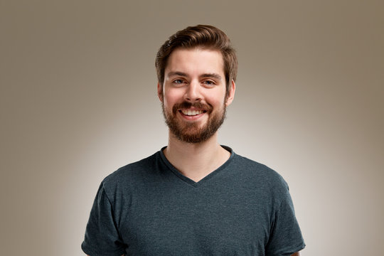 Portrait of smiling young man with beard