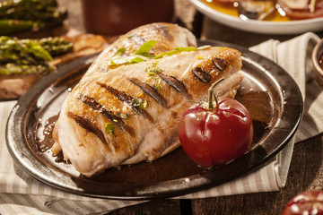 Barbecued lean chicken breasts with herbs