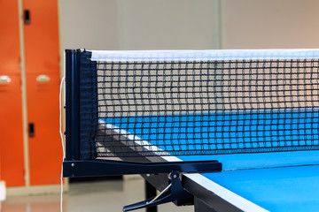 Close up of equipment for Table Tennis with locker backgound.