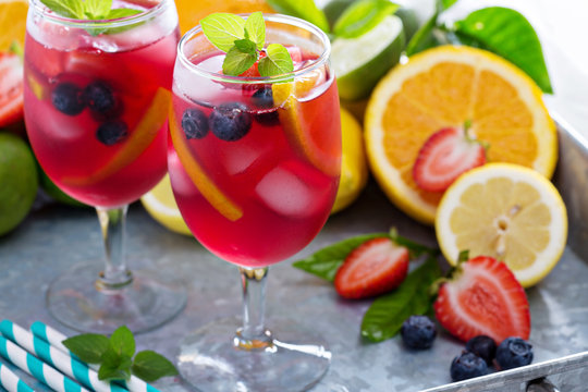 Ice cold red sangria with citrus fruits