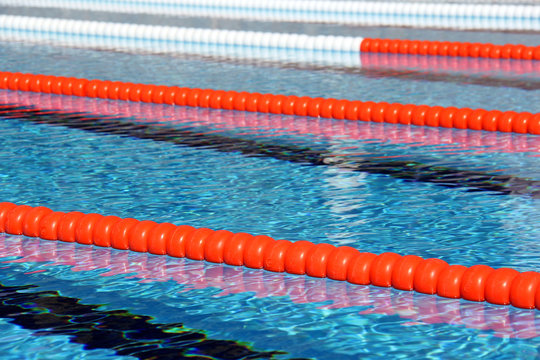 View of lane rope in an outside Olympic pool.