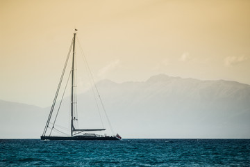 Sailboat floating on quiet sea
