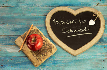 Back to school - blackboard and school equipment in old style