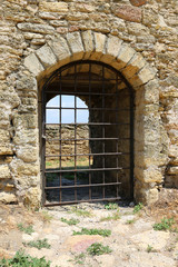 grill on entrance in old castle
