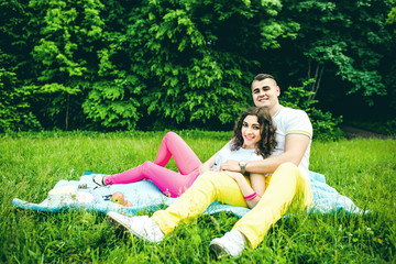 Happy couple relaxing outdoor in the green park