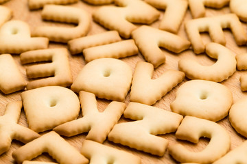Letter Cookie over the wooden table