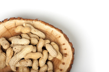 Pile of unshelled peanuts, isolated on white background