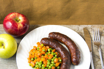 Sausages with vegetables and fruits