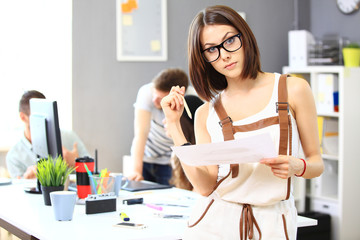 Image of  successful businesswoman looking at camera at meeting