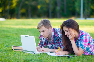 Young teen couple with laptop computer