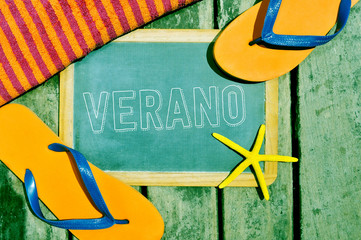 flip-flops, starfish and chalkboard with the word verano, summer
