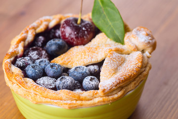 Decorated homemade shortcrust pastry berry pie with blueberries