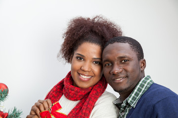 Portrait of husband and wife next to the christmas tree