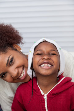 Portrait of mother and daughter smiling