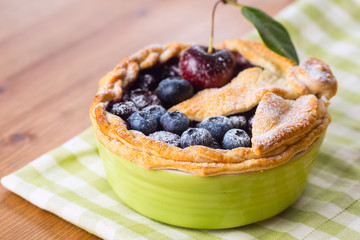 Decorated homemade shortcrust pastry berry pie with blueberries