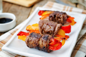 beef stuffed peppers, carrots and onions with balsamic dressing