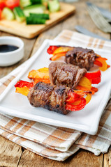 beef stuffed peppers, carrots and onions with balsamic dressing