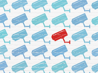 Privacy concept: cctv camera icon on wall background